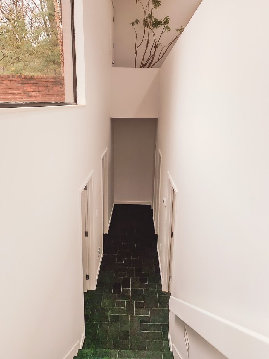 A hallway in a high-end home painted cleanly
