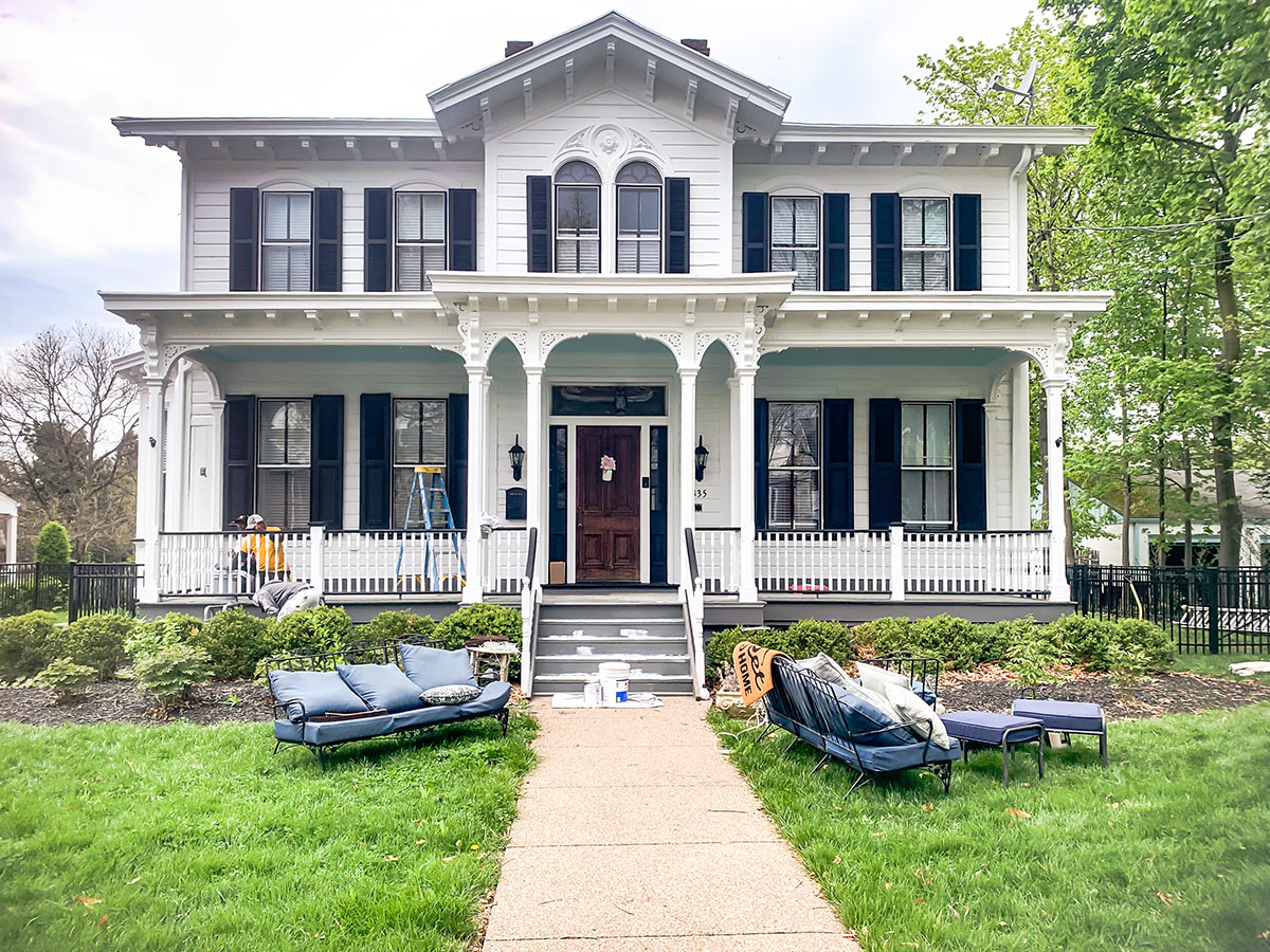 A white house having its exterior painted.